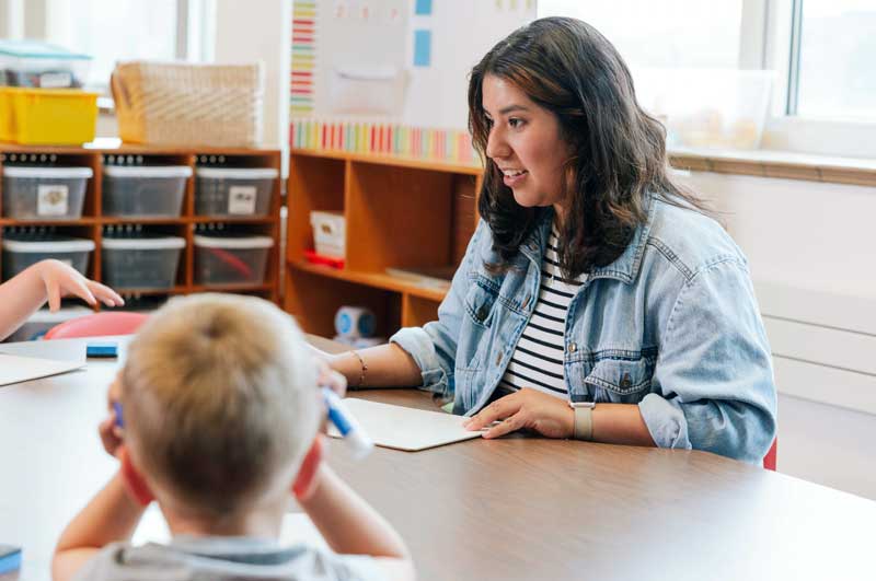 teacher talking to children